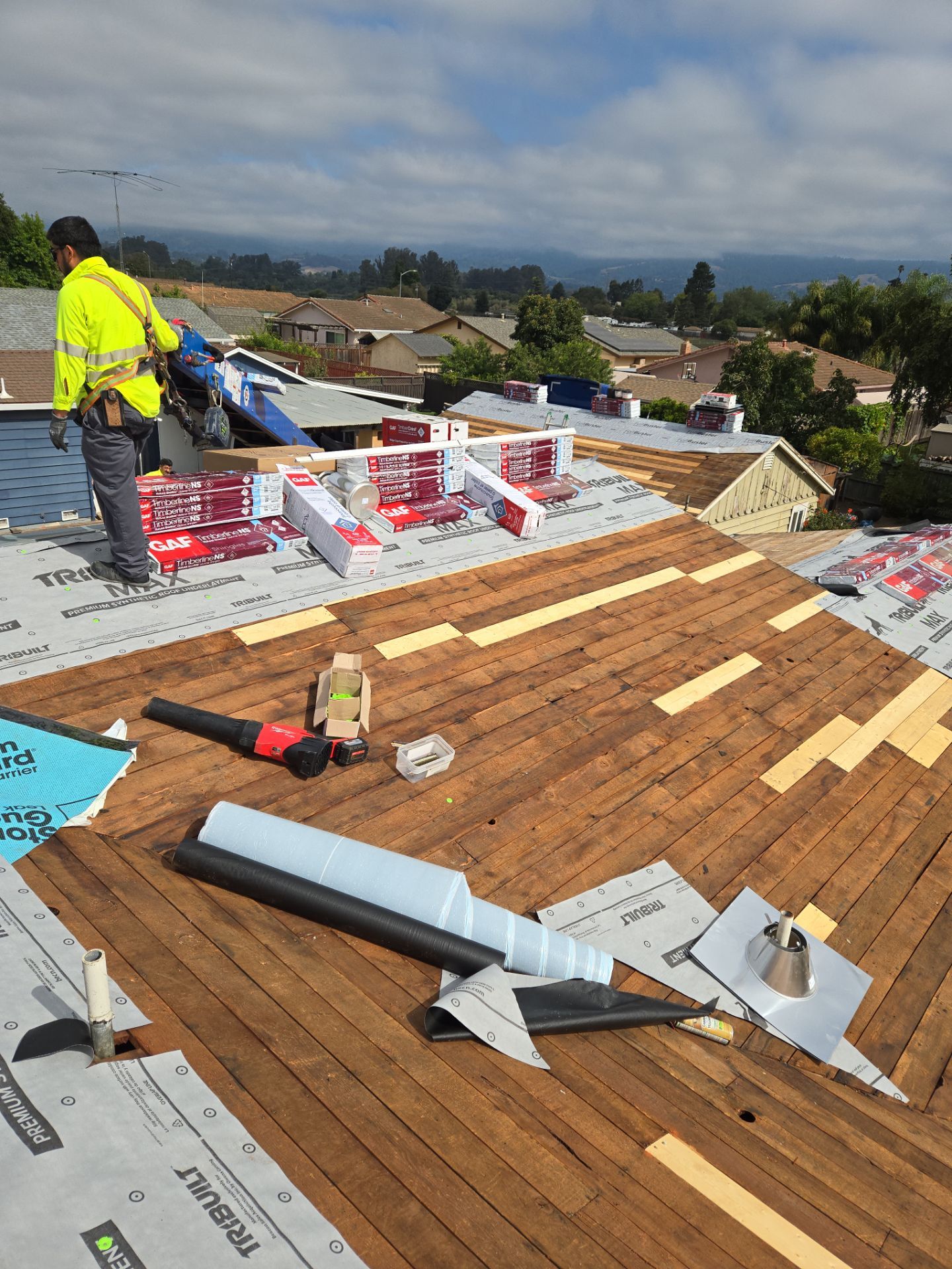 Blue Sky Roofing Group crew member installing new underlayment during an insurance-approved roof repair