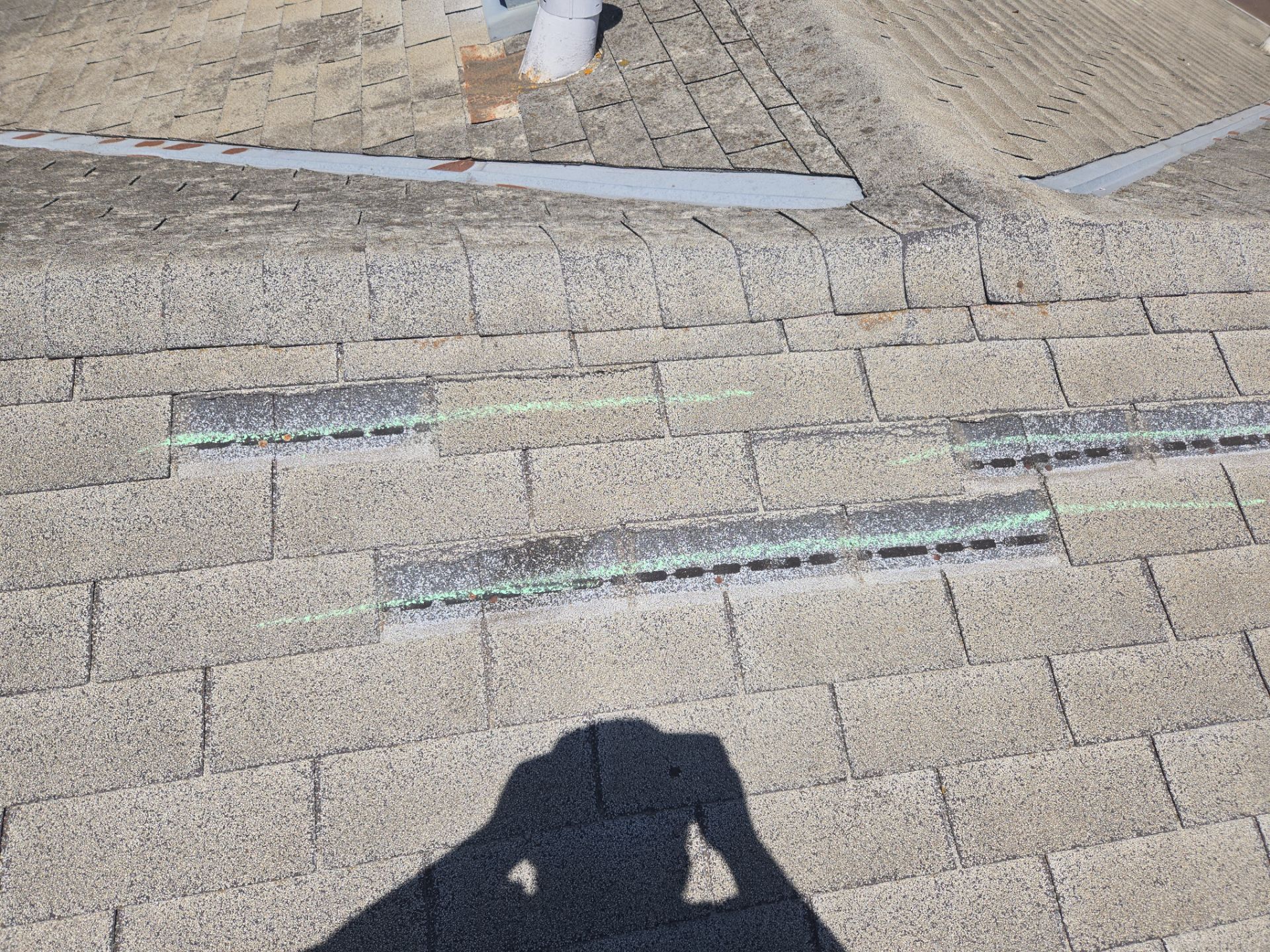 Chalk-marked roof damage during inspection