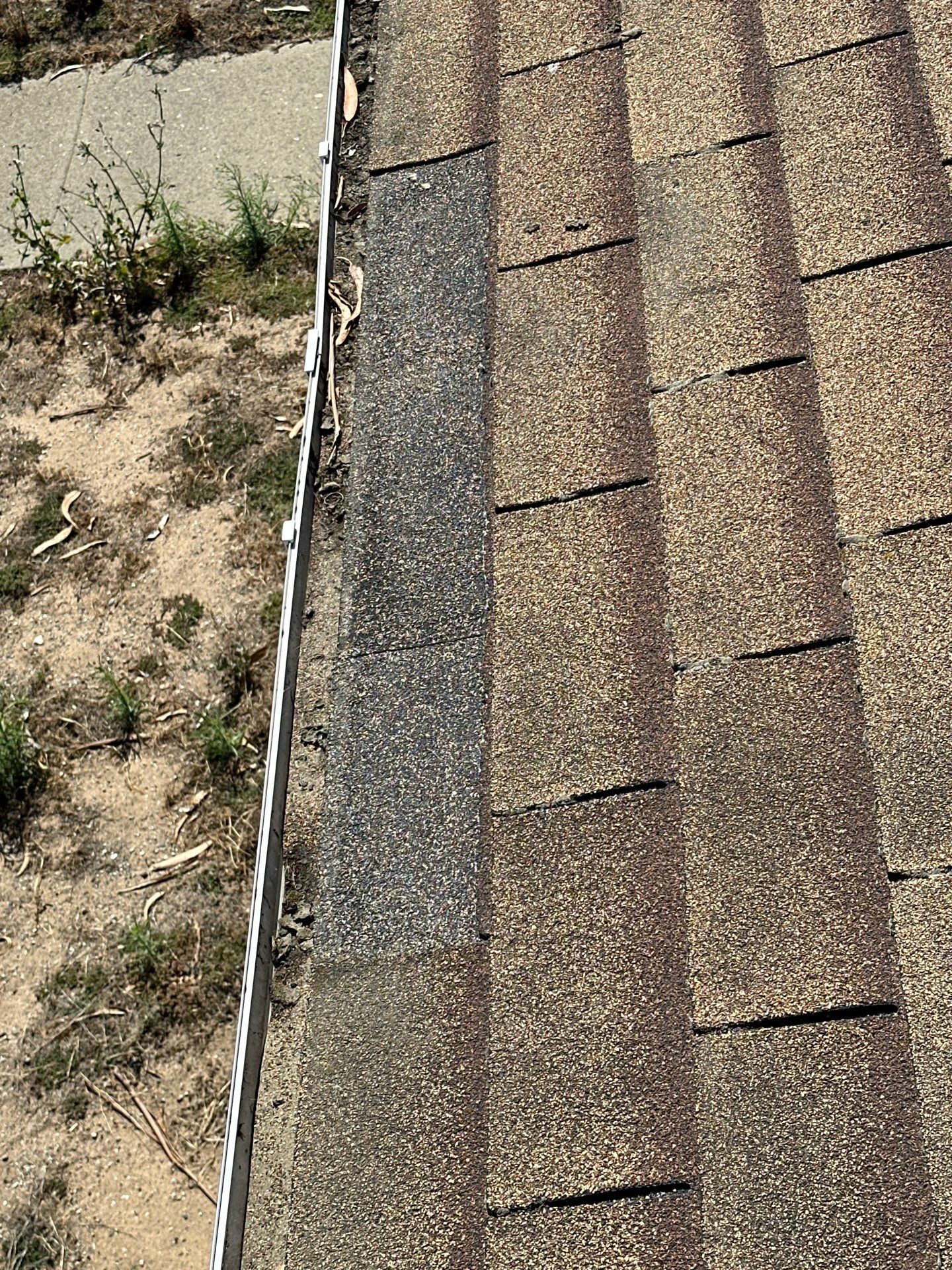 Damaged roof edge near gutter line